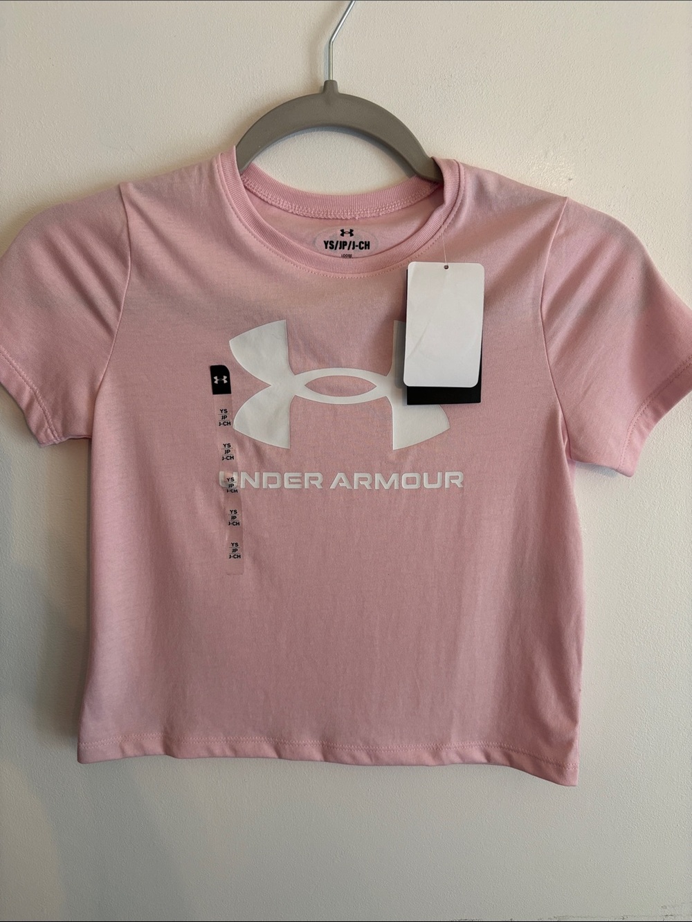 Under Armour Kids Short Sleeve Tee in Light Pink with White Logo